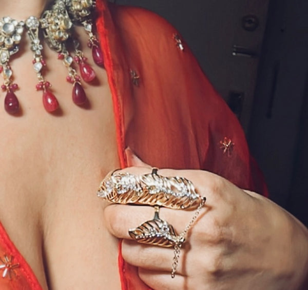 Gold with Rhinestone details double ring with chain attachment